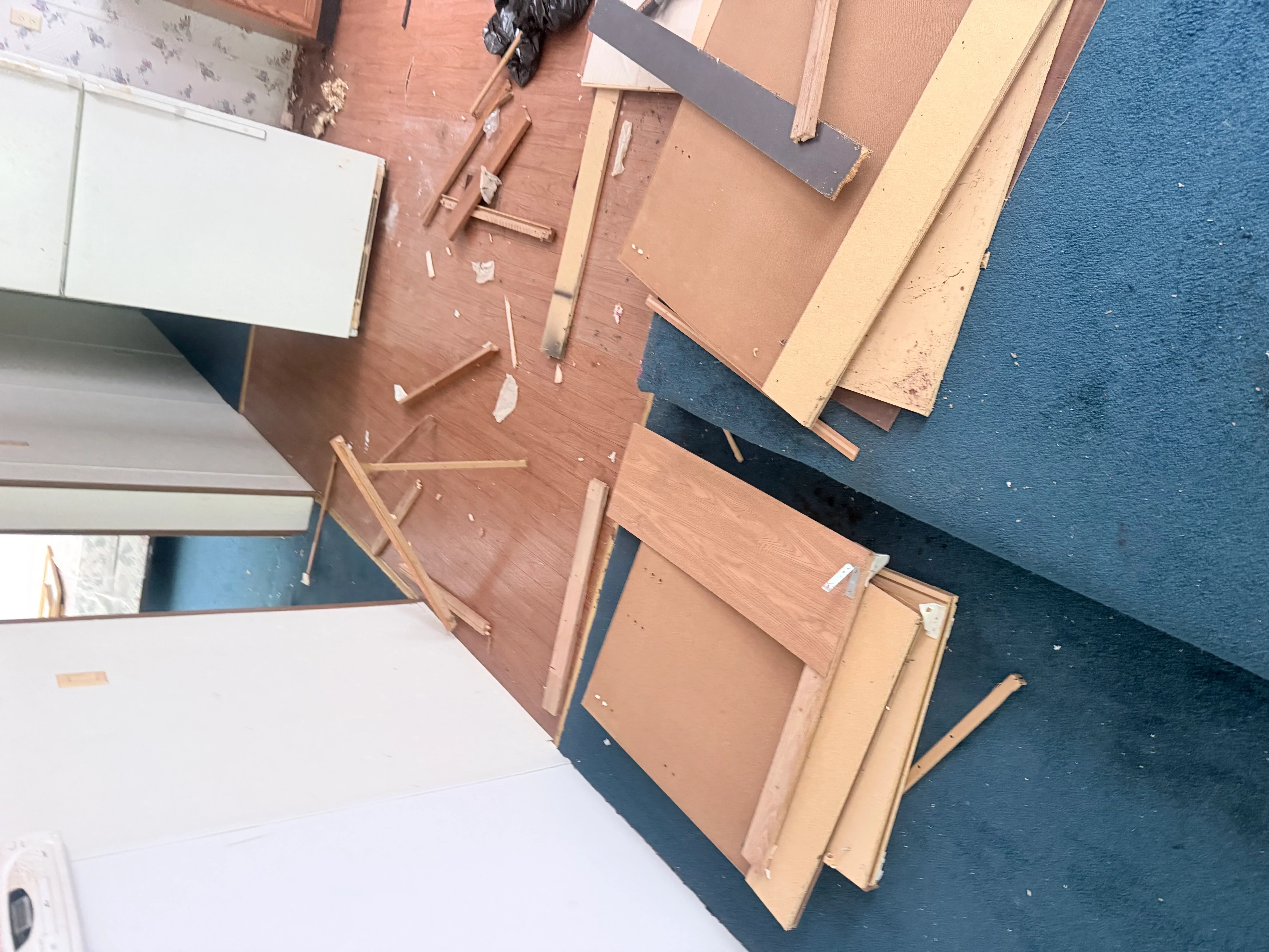 Pile of drywall, wood framing, and construction debris ready for removal
